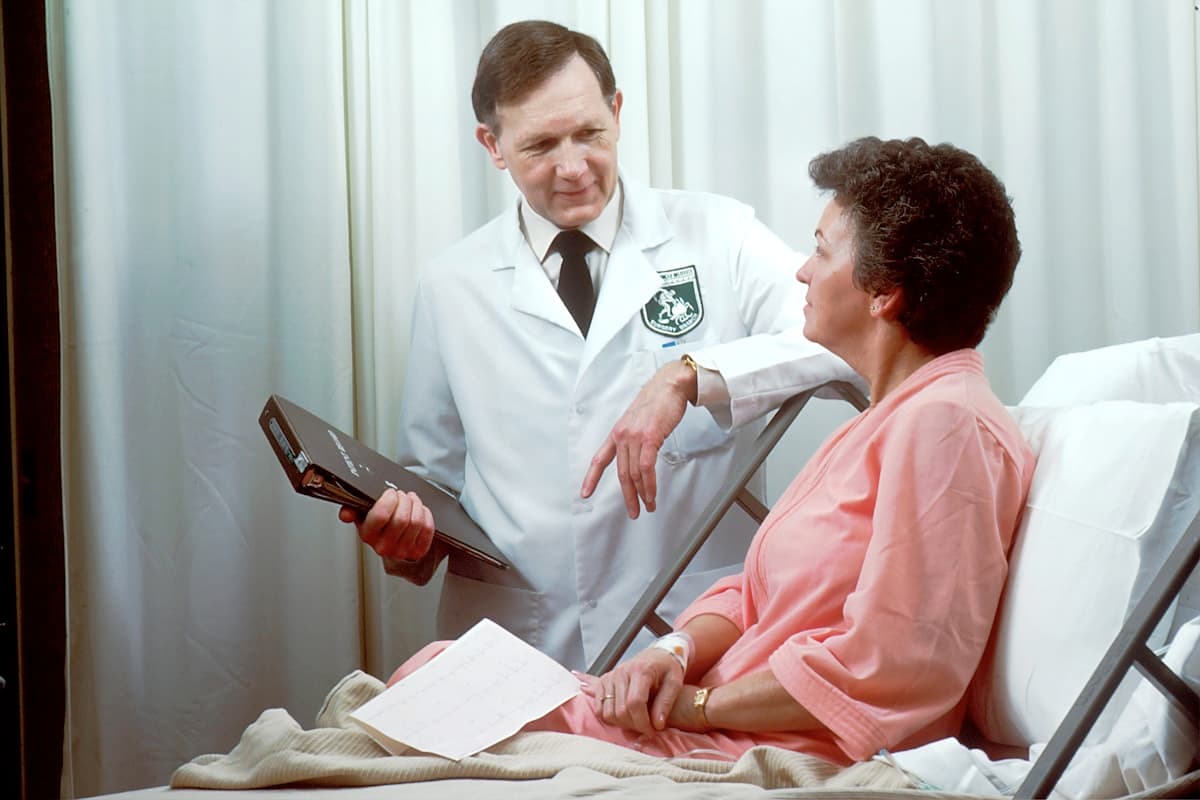 Nurse checking blood pressure of a senior citizen at home in Bhopal